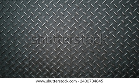 Abstract photograph with texture of stainless steel sheet, steel plate, non-slip used in industrial plants.