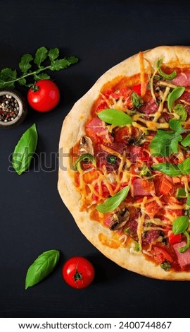 Picture of an American vegetable pizza with cheese, topped with pieces of tomatoes and mint, 4K.