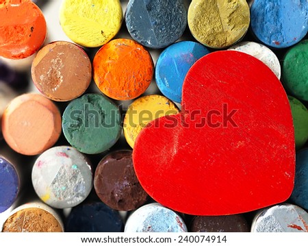 Heart on the background color, dry pastels. The visible surface of crayons.                                               