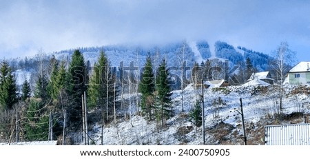 A stunning winter landscape unfolds with snow-capped trees, fir trees and majestic mountain ranges. The serene scene conveys the beauty of nature transformed in winter, creating a picturesque picture