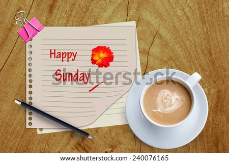  Happy sunday word and coffee cup on wooden background.