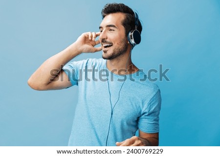 Man headphone happy online music portrait Royalty-Free Stock Photo #2400769229