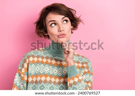 Photo of pensive minded pretty lady hand touch chin look empty space contemplate isolated on pink color background