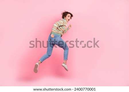 Full body length photo of funky running away trampoline young woman nervous confused scared anxious isolated on pink color background Royalty-Free Stock Photo #2400770001