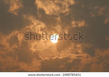 "Surya I am true but covered with clouds, The intense brightness of the light keep in chest" Royalty-Free Stock Photo #2400785651