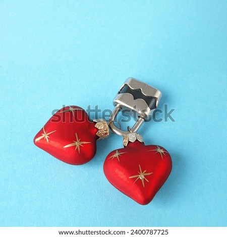 Two red hearts connected by a padlock