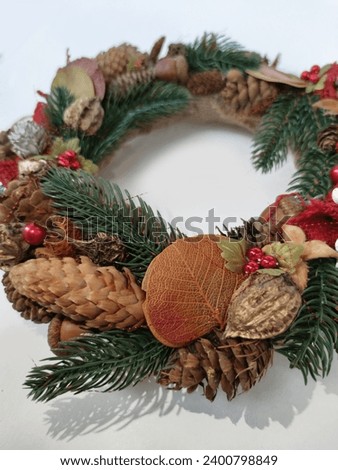 Christmas Wreath of pine branches, cones, leaves, beads and snowflakes. Holiday Decoration Gift For family and friends. New Year's home wall decor different angles handmade top view, side view	