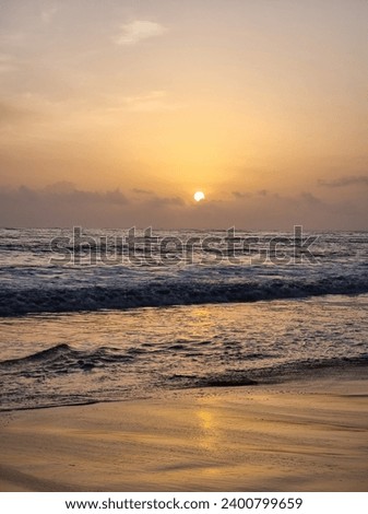 beach view.
picture of sunset.
the reflection of sunlight gives a golden yellow shade to waves.
sea waves trying to kiss the sand.
best picture for painting.