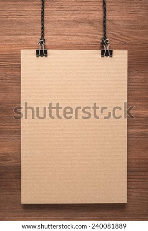 Paper signboard on wooden background  