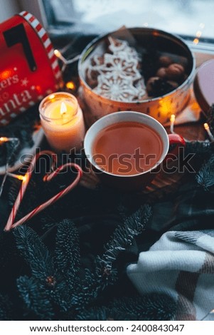 A cup of tea with smoke in a Christmas atmosphere, mood.