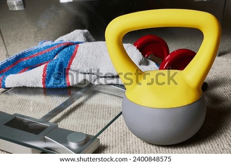 Kettlebell. Fitness objects, kettlebell, dumbbell, towel and a scale