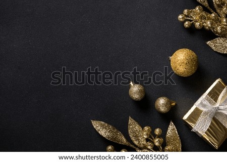 Christmas gold decorations on black.