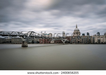 Millenium Bridge over the River Thames and St. Paul's Cathedral in London