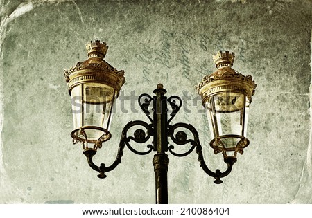 picture of an antique street lamp with vintage style texture overlaid effect 