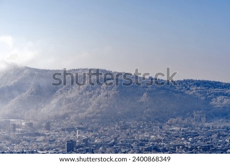 Scenic view of local mountain with snow covered landscape and communications tower on a sunny autumn day. Photo taken December 3rd, 2023, Zurich, Switzerland.