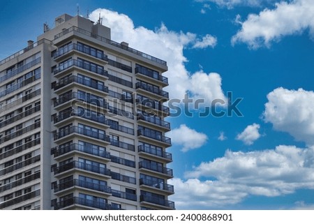 Building with a beautiful blue sky with clouds Royalty-Free Stock Photo #2400868901