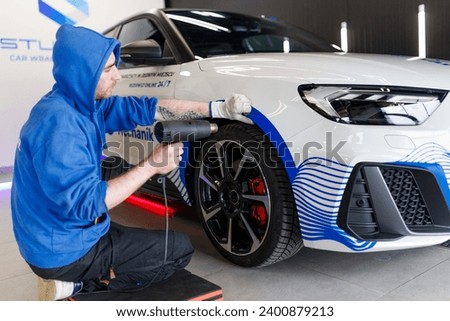 Car tinting, color change, detailing, protective film Royalty-Free Stock Photo #2400879213