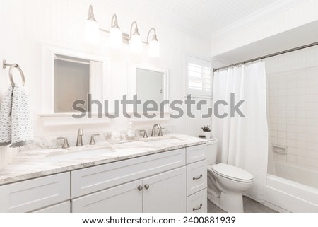 Photoshoot Footage located in Florida, USA. Clean, modern bathroom with refreshing shower, reflecting mirror, Bathtub and sleek tiles. Royalty-Free Stock Photo #2400881939