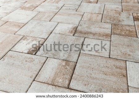 Pool area tiles and tiling around the back patio, new home construction in South Florida. Royalty-Free Stock Photo #2400886243