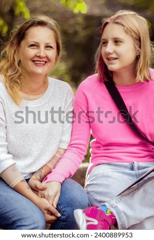 Cute woman of european appearance age over 40 years close-up street portrait