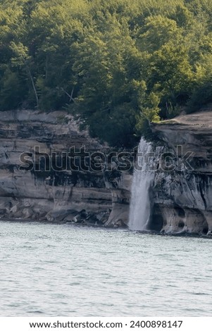 Natural Waterfall over rocks outdoors