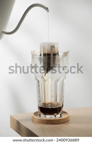 Coffee drip bag. The hot water is poured over the roasted and ground coffee, in a filter paper ready to use.