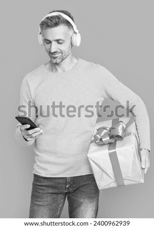 happy shopping man buy online isolated on blue. shopping man buy online in studio.