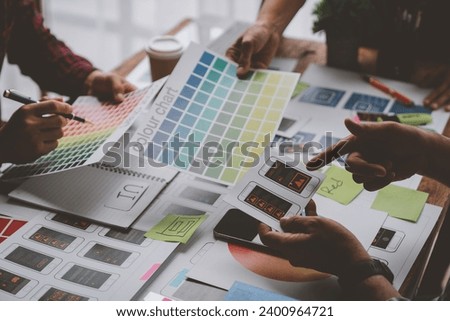 Web creative team Graphic designer planning for mobile phone choose color template draw app website ux ui for mobile application and development model Prototype outline development process.