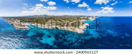 Drone shot, Rocky Coast with Villas and Hotels, Cala Tropicana and Cala Domingos, Porto Colom Region, Majorca, Balearic Islands, Spain