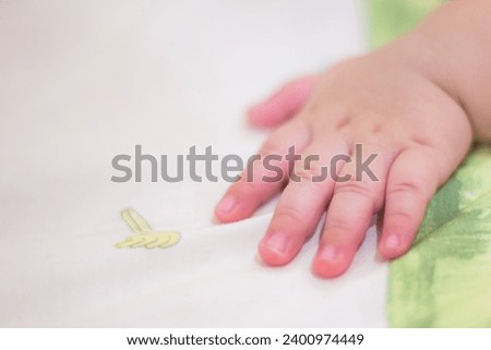 selective focus, hands of babies under 1 year old