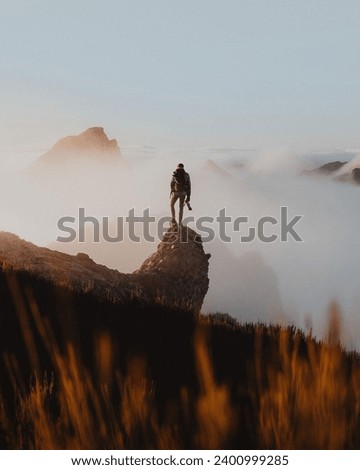 A Person Standing On A Top Of Madeira  Royalty-Free Stock Photo #2400999285