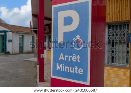 Arret Minute road panel french text means One minute stop sign for cars area