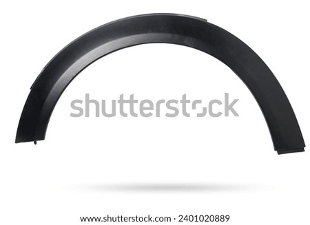 Black plastic fender flare on a white isolated background in a photo studio for sale or replacement in a car service. Mudguard on auto-parsing for repair or a device to protect the body from dirt.
