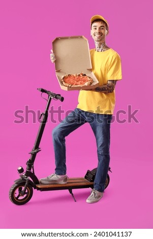 Male worker of food delivery service with tasty pizza and kick scooter on purple background