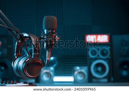 Professional microphone and headphones at the radio station, entertainment and communication concept Royalty-Free Stock Photo #2401059965