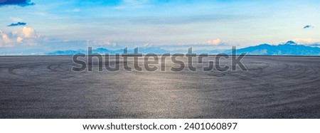 Asphalt road square and mountain with sky clouds at sunset. panoramic view.