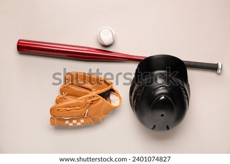Baseball glove, bat, ball and batting helmet on light grey background, flat lay Royalty-Free Stock Photo #2401074827