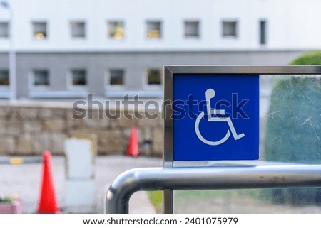Blue handicap, wheelchair access sign, handicapped, physically challenged and disabled concept.