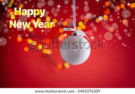 New Year's toys, decorations and other items on a red abstract background. New Year background.