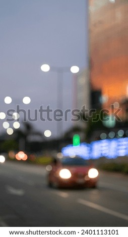 Blurred vehicle light in developed African city.