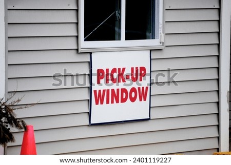 A Generic Pick-Up Window Sign During the Covid Pandemic	