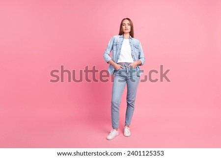 Full size photo of pretty young girl posing model defile shopping dressed stylish denim outfit isolated on pink color background