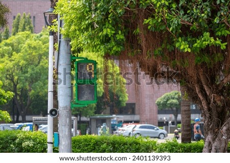 Unique pedestrian signal light little green man traffic light in Taipei, Taiwan