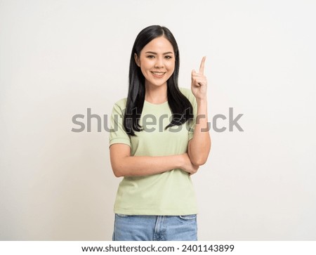 Beautiful young asian woman in green shirt. Charming female lady standing pose thinking on isolated white blank background. Asian woman cute people have idea looking copy space for text advertise Royalty-Free Stock Photo #2401143899