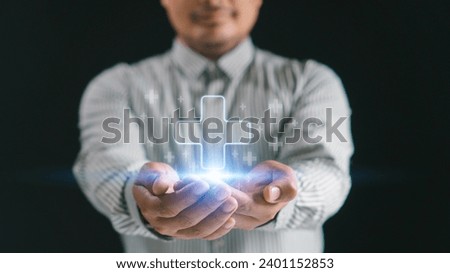 Mental health care mental rejuvenation concept. Man smiling hand holding virtual blue plus sign for positive thinking mindset or healthcare insurance symbol. Royalty-Free Stock Photo #2401152853