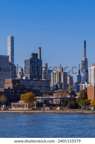 Vertical view of buildings in central Manhattan New York seen from the East River
