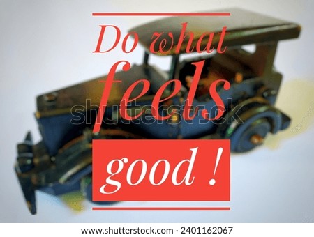 Do what feel good written on blurry image of wodden car toy.
