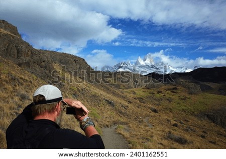 Tourist taking photo of Fitz Roy mountain, Travel in Patagonia, Argentina
