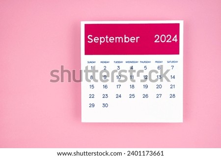 calendar page September 2024 on pink color background. Royalty-Free Stock Photo #2401173661