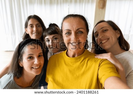 multigenerational women selfie. Women of different ages and ethnicities together Royalty-Free Stock Photo #2401188261